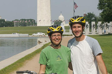 image of bikers in front of Washington DC monument